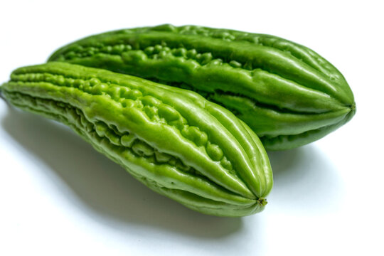 bitter melon, also known as bitter gourd or Momordica charantia isolated on white background 