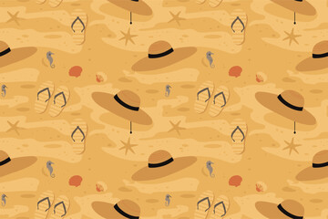 Summer vacation beach scene with hats and beach accessories on a sandy shore from a top view