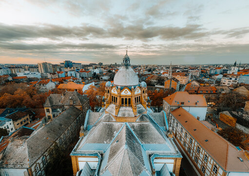 Aerial view of the striking dome of the Serbian National Theatre rises amidst the cityscape, blending architectural grandeur with urban sprawl, Novi Sad, Vojvodina, Serbia.