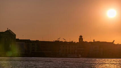 Beautiful sunrise in Grand canal over Venice near San Marco square timelapse. View from Church of Santa Maria della Salute, Venice, Italy, European Union. © HyperlapsePro