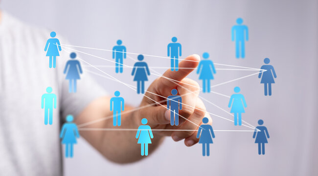 Concept of social network and global connections visualized. Human hand touching icons representing people conn - Powered by Adobe