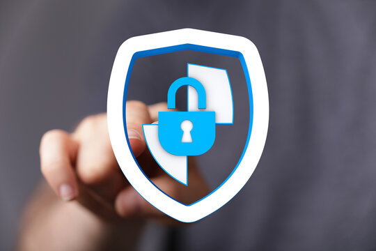 Hand touching digital shield with padlock as cybersecurity and data protection concept. Privacy and information protection. - Powered by Adobe