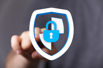 Hand touching digital security lock shield, representing data protection, cyber safety, secure access, and digital privacy on the int