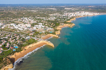 Algarve Luxury Real Estate: Panoramic 4K Aerial View of Premium Villas and Resorts in Arma&ccedil;&atilde;o de P&ecirc;ra Overlooking the Turquoise Coastline of Praia de Albandeira, Portugal