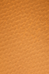 Brown vertical corrugated paper with scales like pattern