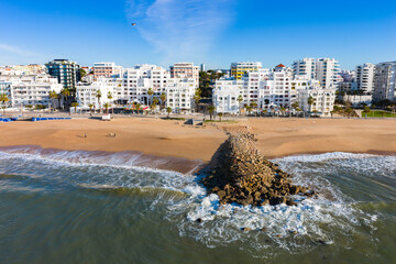 Golden Algarve Sunrise: Cinematic 4K Aerial of Quarteira Featuring Beachfront High-Rise Apartments, the Calçadão Promenade, and the Atlantic Horizon, Portugal © Mike Workman