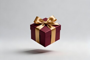 Fototapeta premium Luxurious red gift box with a golden bow suspended in air, perfect for celebrations and special occasions.