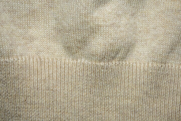 Textura o fondo de tejido de lana de jersey blanco o beige. 