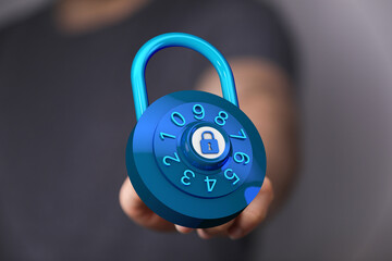Close up shot of a person holding a blue padlock. Concept of data protection, safety, and security measures. Su