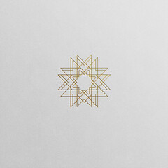 Golden star geometric symbol isolated on white background.	
