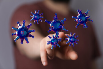 3D render of virus particles floating near a human hand, representing concept of disease and health, touching