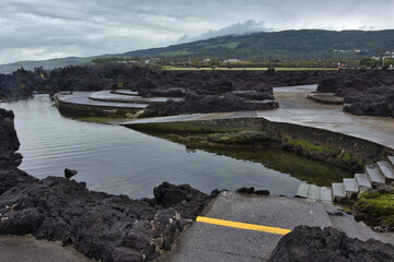 Bathing area of ​​Biscoitos, Terceira Island, Azores, Portugal. Pools with natural waters from the Atlantic Ocean and basalt rocks. © ANTONIO