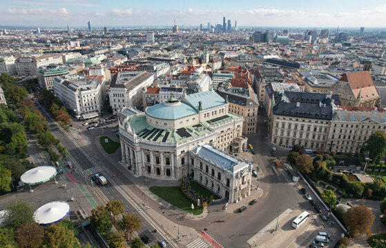 Aerial view of the grand Vienna State Opera, its pale facade a stark contrast to the bustling city below, Vienna, Vienna, Austria.