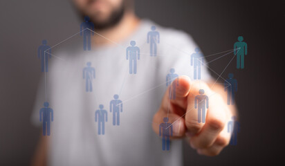 Man touching digital human network, representing connection, communication, interaction and teamwork. Global ne