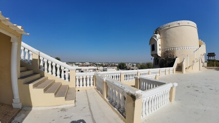 Exterior Architectural Detail of a Rajputana Fort Terrace Featuring a Cylindrical Staircase Tower and Heritage Design in Rajasthan, India 