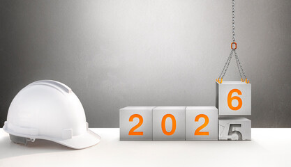 The year 2026 in the concrete cube. The construction crane is lifting the new number 6 to replace the old number 5.