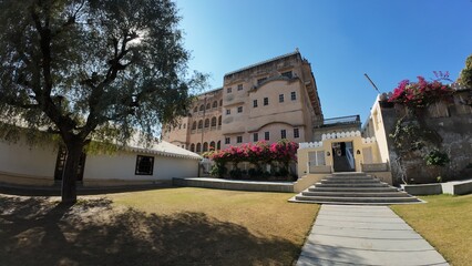 Panoramic View of the Grand Open Courtyard Inside Mandawa Fort Featuring Massive Heritage Walls and Garden Landscaping in Rajasthan