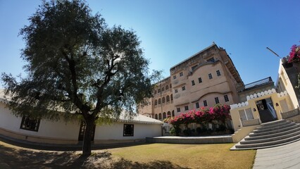 Panoramic View of the Grand Open Courtyard Inside Mandawa Fort Featuring Massive Heritage Walls and Garden Landscaping in Rajasthan