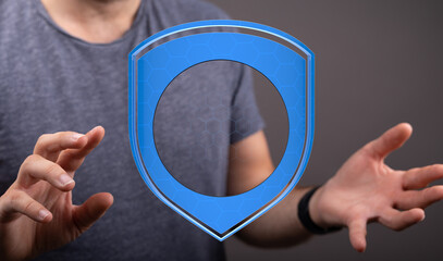 Image of a man holding a stylized blue shield, representing security, protection, and digital safety. Perfect for cybersecurity, data