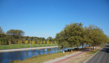 River in the park. Minimalist view. Nature backdrop. Beautiful natural flyer, card design. Nature Template for presentation or product 