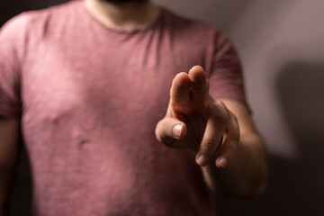 Close-up of a hand pointing or touching. Represents choices, interaction, decision-making, and connection. Great