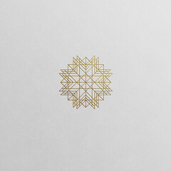 Geometric flower symbol in luxury gold shades isolated on white background.