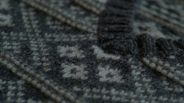 Macro close-up of textured wool fabric with woven pattern. Textile fibers, woolen fabric softness and details