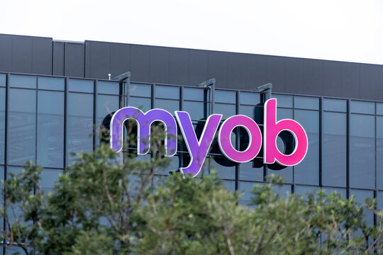 The MYOB logo is displayed on the exterior of a modern office building in Melbourne, Australia. It is an Australian multinational corporation that provides tax, accounting services to businesses.