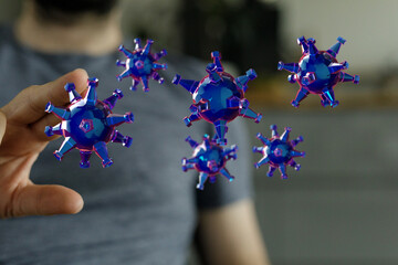 Visual representation of a virus concept in blue and purple colors. Hand touching virus, medical and science c
