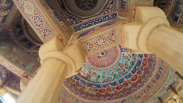 Vibrant Traditional Ceiling Murals and Colorful Frescoes Featuring Intricate Geometric Patterns and Mythological Designs inside a Heritage Memorial Monument in Ramgarh  Rajasthan