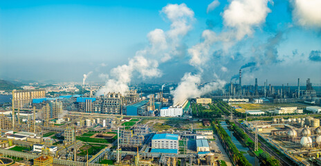 Aerial shot of a large chemical plant and oil refinery with smoking chimneys in industrial area