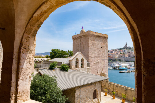 Marseille, France, view to Notre-Dame-de-la-Garde Cathedral through an arch of the Fort Saint-Jean