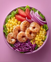 Bright salad bowl filled with grilled shrimp, sweet corn, lettuce, tomato, and purple cabbage on pink, ideal for healthy menu designs and vibrant food promotions.
