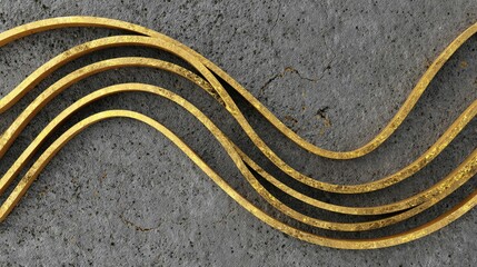 Abstract image of gold lines undulating over a textured, grey concrete surface