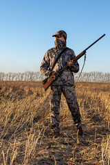 Hunter with hunting gun and hunting form to hunt.