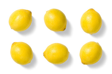 Set of fresh yellow lemons in various positions isolated on a white background. Top view composition ideal for food design, packaging, healthy nutrition concepts, and culinary projects.