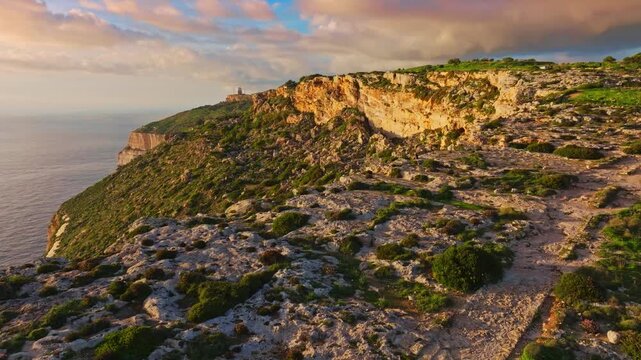 Drone view of countryside, rocks, hills. Famous Dingli cliffs, sunset spot. Mediterranean sea, Malta island