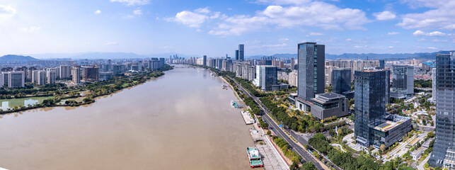 Panoramic view of modern city riverfront with skyscrapers