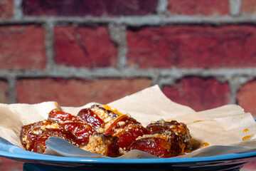 Dates stuffed with nuts and pepper and cooked in honey ancient food