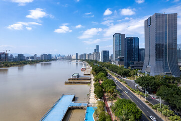 Modern Cityscape Along Riverside with Skyscrapers