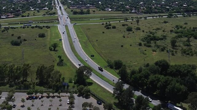 Camera panning up along the N1 highway through the centre town and over the town of Bloemfontein 4K Aerial Video.