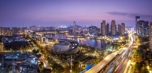 Panoramic Cityscape at Night with Skyscrapers