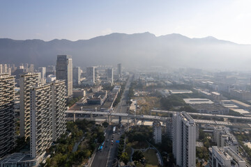 Urban Aerial View with Skyscrapers and Mountains