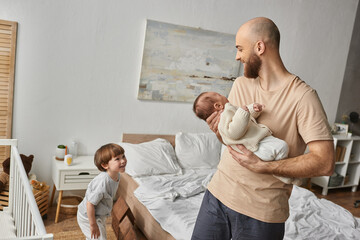 Celebrating the joyous moments of family togetherness in a cozy bedroom setting