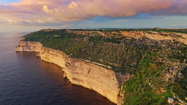 Drone view of countryside, rocks, hills. Dingli cliffs, sunset spot. Mediterranean sea, Maltese island
