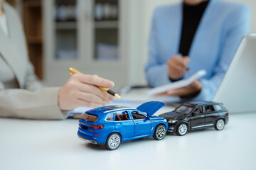 Female signing car insurance document or lease. Writing signature on contract or agreement. Buying or selling new or guarantee.