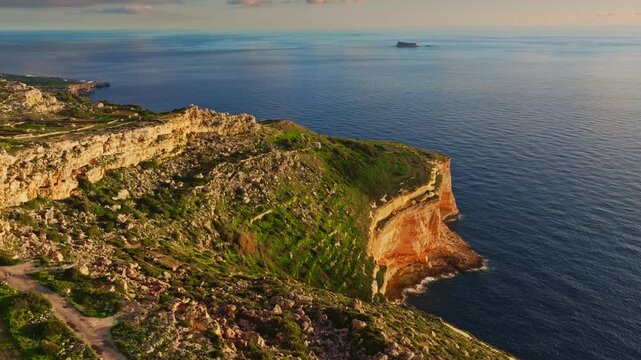 Drone view of sunset spot. Countryside, rocks, hills. Dingli cliffs, Mediterranean sea, Malta