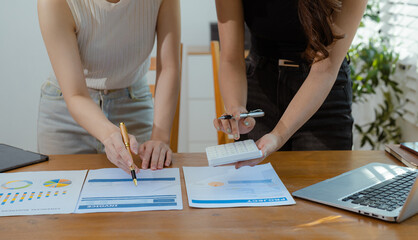 
Business team working on a project in the office or reviewing and discussing a business project.