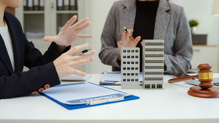 Justice and law concept. Real Estate Law in a courtroom the gavel, working with digital tablet computer.