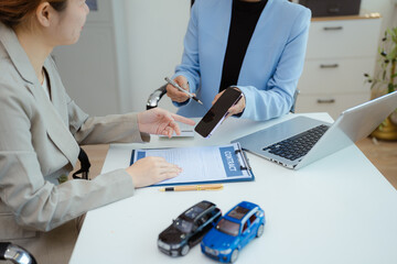 Female signing car insurance document or lease. Writing signature on contract or agreement. Buying or selling new or guarantee.